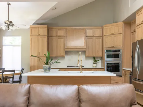 Oak kitchen with a white quartz island