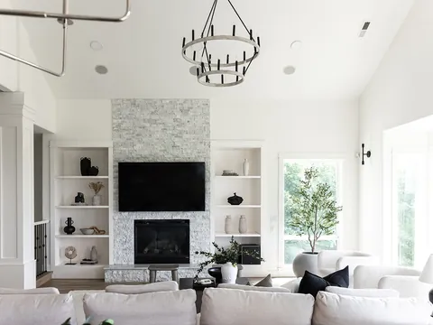 Bright living room with a tiled fireplace