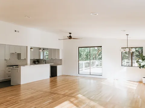 Open kitchen, living and dining area after a whole-home remodel
